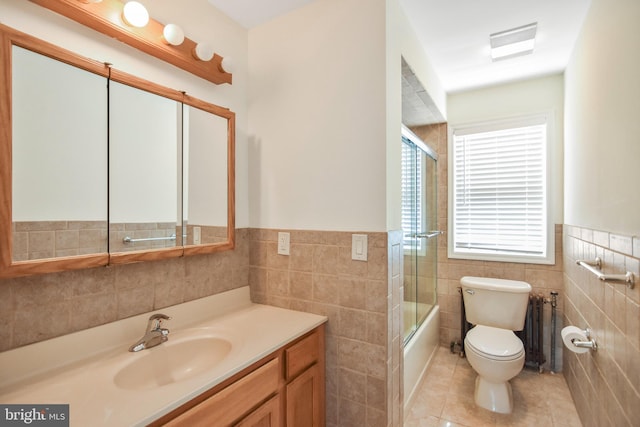 333 Carter Rd, Princeton, NJ 08540 - full bathroom featuring tile walls, radiator, vanity, tile patterned floors, and wainscoting