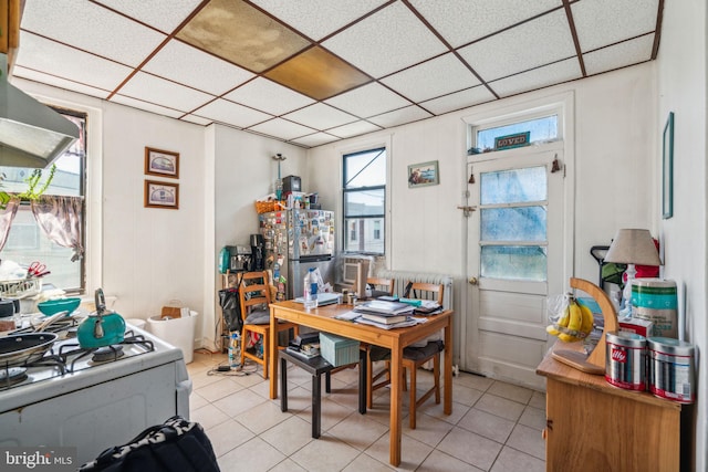 office featuring a drop ceiling and light tile patterned floors