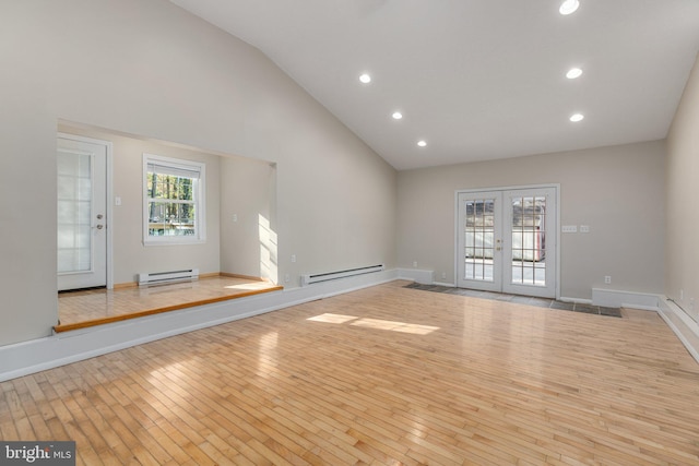 273 Four Seasons Dr, Drums, PA 18222 - unfurnished living room featuring baseboard heating, french doors, recessed lighting, and hardwood / wood-style flooring