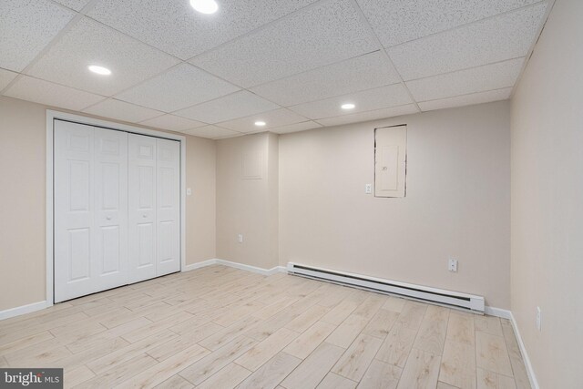 273 Four Seasons Dr, Drums, PA 18222 - finished basement featuring baseboards, electric panel, light wood-type flooring, recessed lighting, and a baseboard heating unit