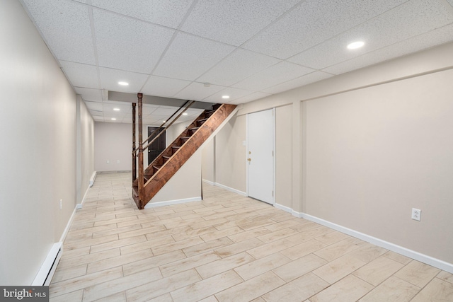 273 Four Seasons Dr, Drums, PA 18222 - finished basement with baseboards, a paneled ceiling, baseboard heating, recessed lighting, and stairs
