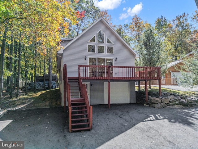 273 Four Seasons Dr, Drums, PA 18222 - back of property with stairway, a deck, an attached garage, and driveway