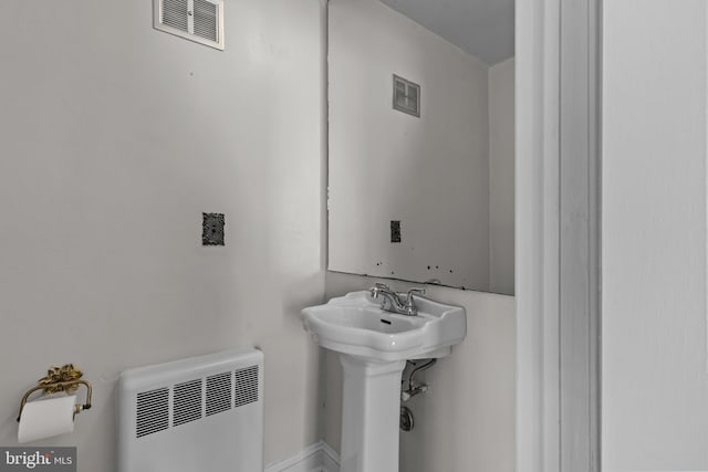 bathroom with radiator heating unit