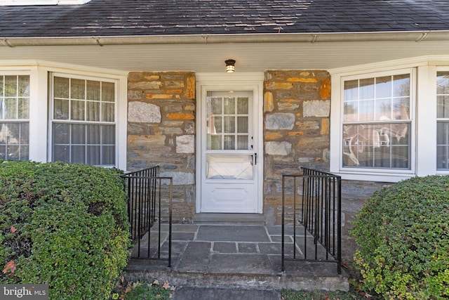 doorway to property featuring a porch