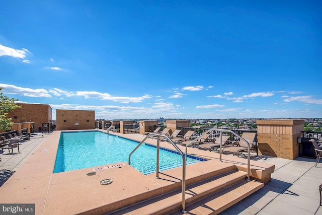 view of pool featuring a patio