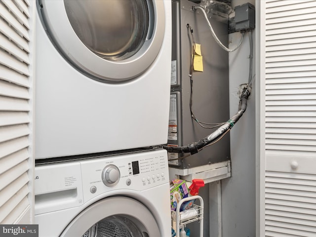 laundry area featuring stacked washer and clothes dryer