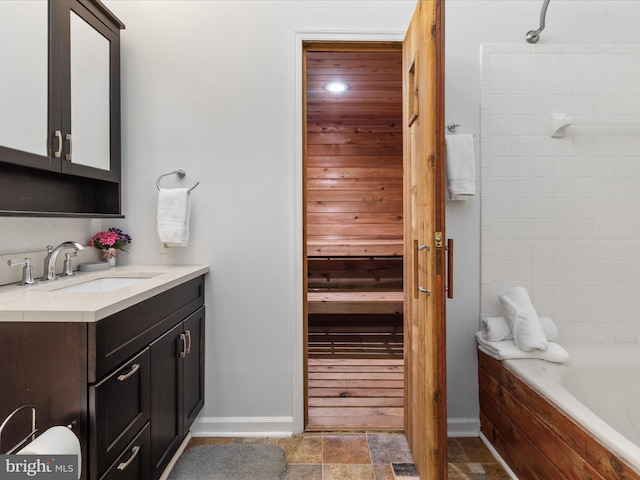 bathroom with shower / bathing tub combination and vanity