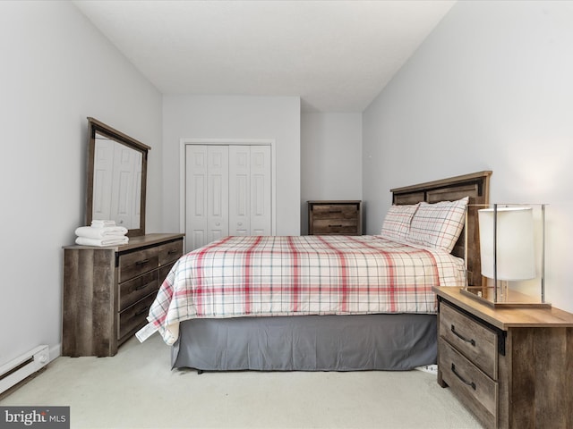 bedroom featuring light carpet, a baseboard radiator, and a closet