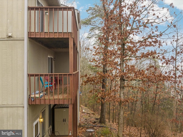 view of side of home featuring a balcony