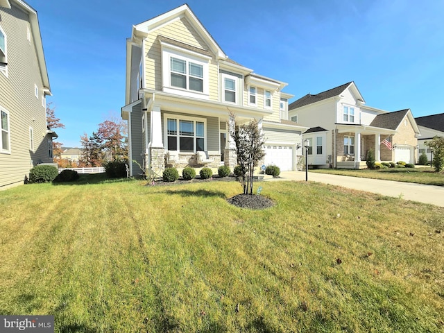 view of front facade with a front yard and a garage