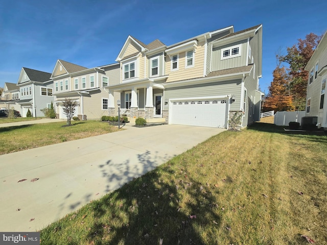 view of front of house with a front yard and a garage