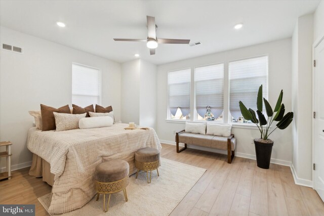 bedroom featuring light wood-type flooring and ceiling fan