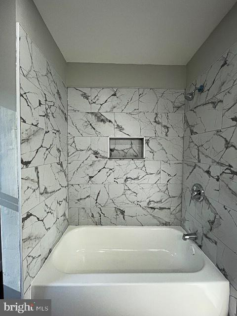 bathroom with shower / bathtub combination