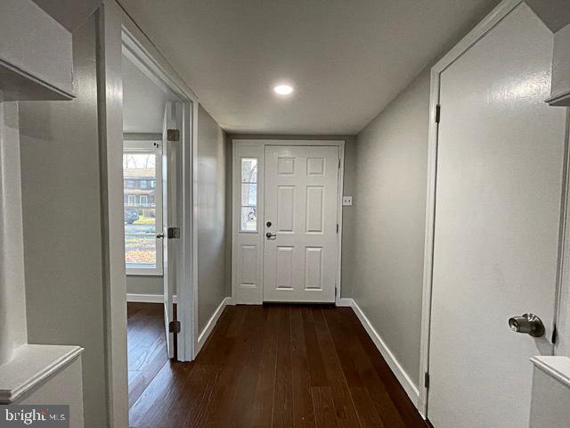 doorway to outside with dark hardwood / wood-style flooring