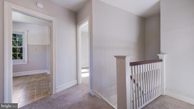 corridor with light carpet