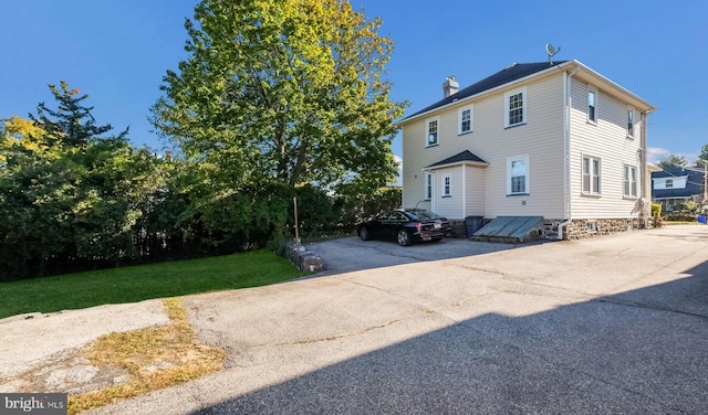 view of home's exterior featuring a lawn