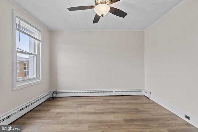 unfurnished room featuring a baseboard radiator, light wood-type flooring, and ceiling fan