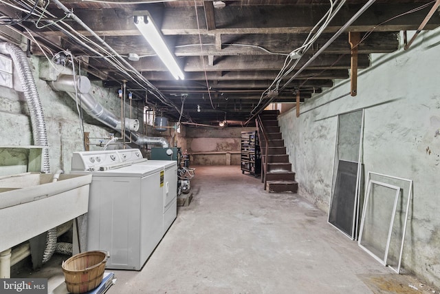 basement featuring sink and washer and clothes dryer