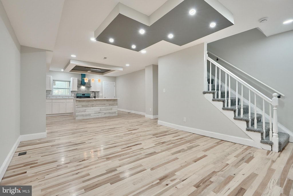 unfurnished living room with light hardwood / wood-style flooring