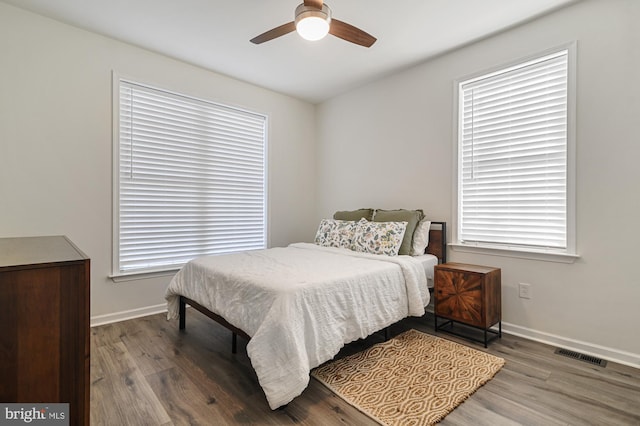 bedroom featuring wood-type flooring and ceiling fan