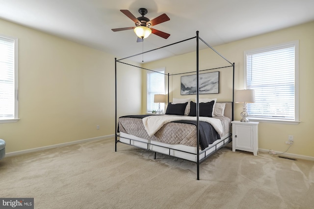 bedroom with light colored carpet