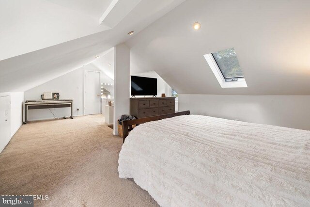 bedroom featuring lofted ceiling and light colored carpet