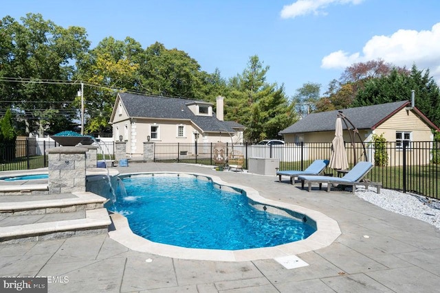 view of swimming pool featuring a patio and pool water feature