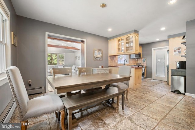 dining space featuring a baseboard radiator