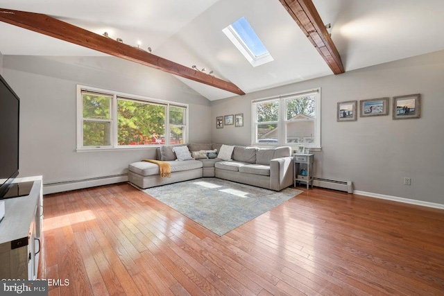 living room featuring a baseboard radiator, vaulted ceiling with skylight, and light hardwood / wood-style flooring