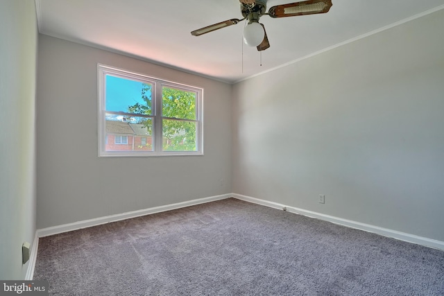 carpeted empty room featuring crown molding and ceiling fan