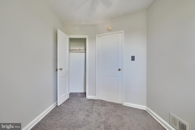 unfurnished bedroom featuring light colored carpet