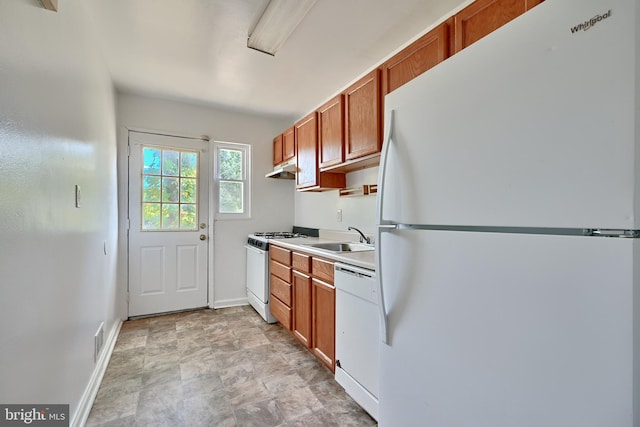 kitchen with sink and white appliances