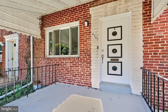 doorway to property featuring covered porch