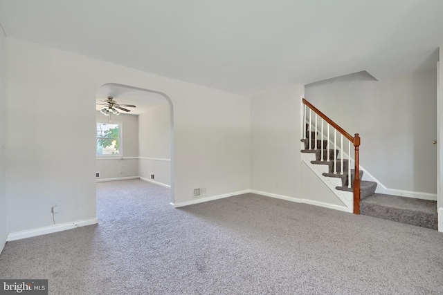 carpeted spare room featuring ceiling fan