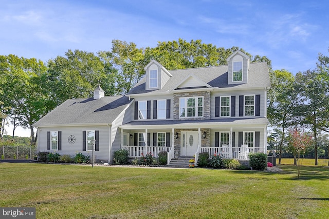 view of front of house with a front lawn and a porch