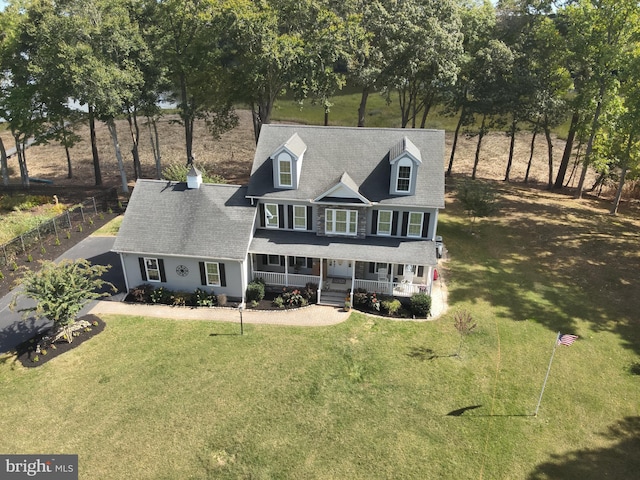 view of front of home featuring a front lawn and covered porch