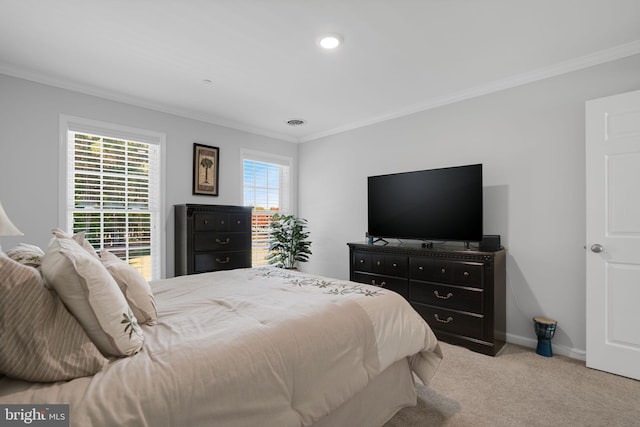 bedroom featuring ornamental molding, light carpet, and multiple windows