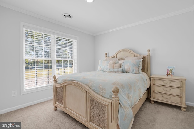 carpeted bedroom with crown molding