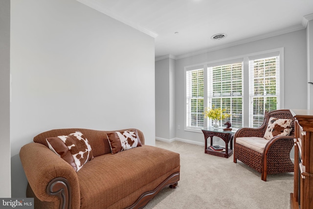 sitting room with light colored carpet and ornamental molding