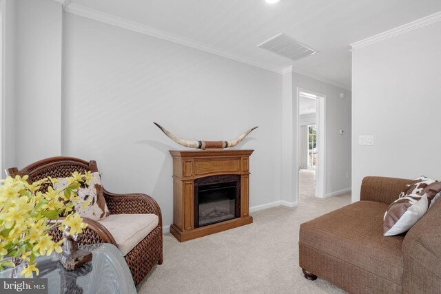 carpeted living room with ornamental molding