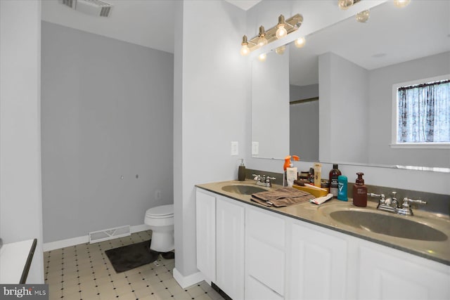 bathroom with vanity and toilet