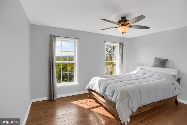 bedroom with wood-type flooring and ceiling fan