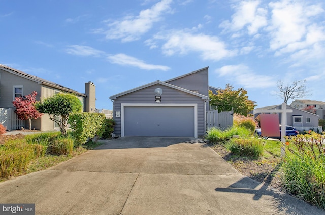 view of front of property with an outbuilding and a garage