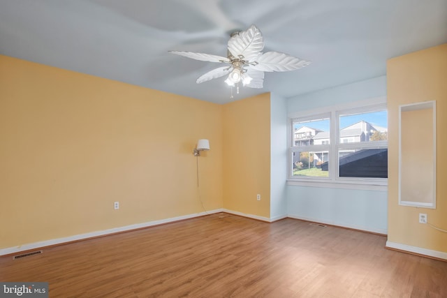 spare room featuring ceiling fan and hardwood / wood-style floors