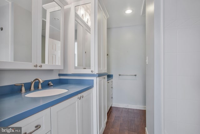 bathroom with vanity and hardwood / wood-style flooring