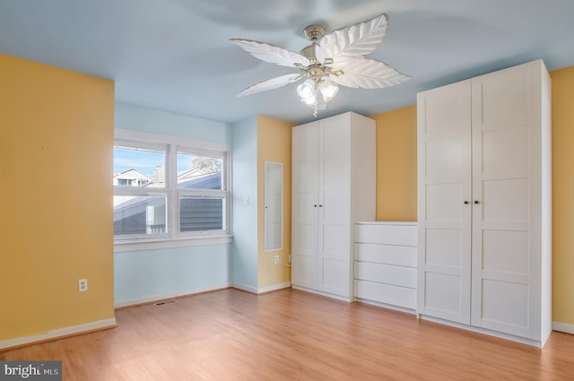 unfurnished bedroom with a closet, ceiling fan, and light wood-type flooring