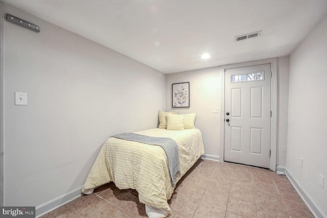 bedroom featuring light tile patterned floors