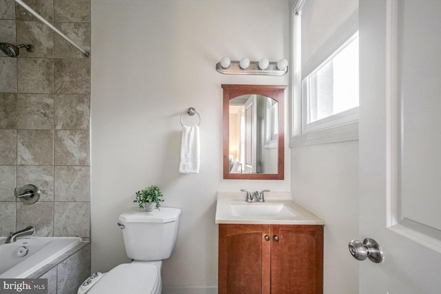 full bathroom with vanity, toilet, and tiled shower / bath