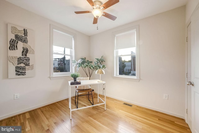 home office featuring ceiling fan and wood-type flooring