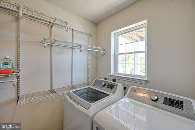 washroom featuring washing machine and dryer